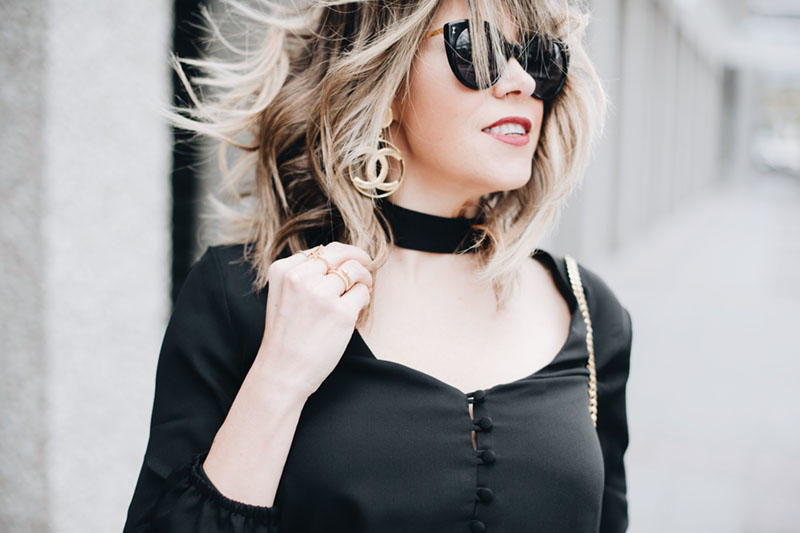Blogger Lindsey Lutz from Life Lutzurious is wearing a silk choker top and Chanel earrings